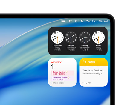 Mac 台式电脑上显示 macOS Tahoe 和各种小组件，包括时钟、日历和备忘录。