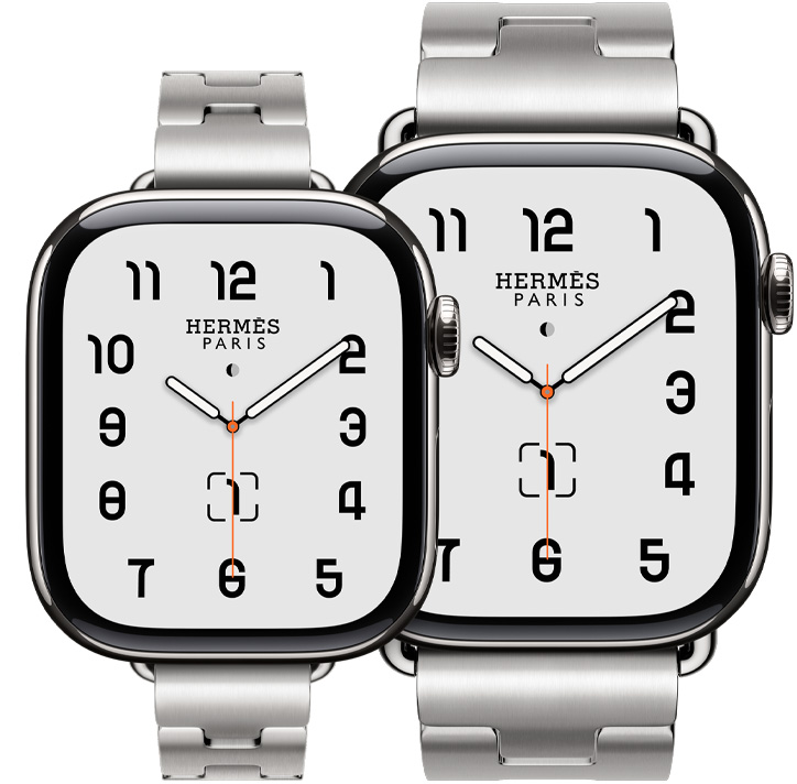 两只 Apple Watch Hermès Series 11 设备，展示银色钛金属表壳，分别搭配 Satiné 缎灰色 Grand H Fin 表带和 Grand H 表带