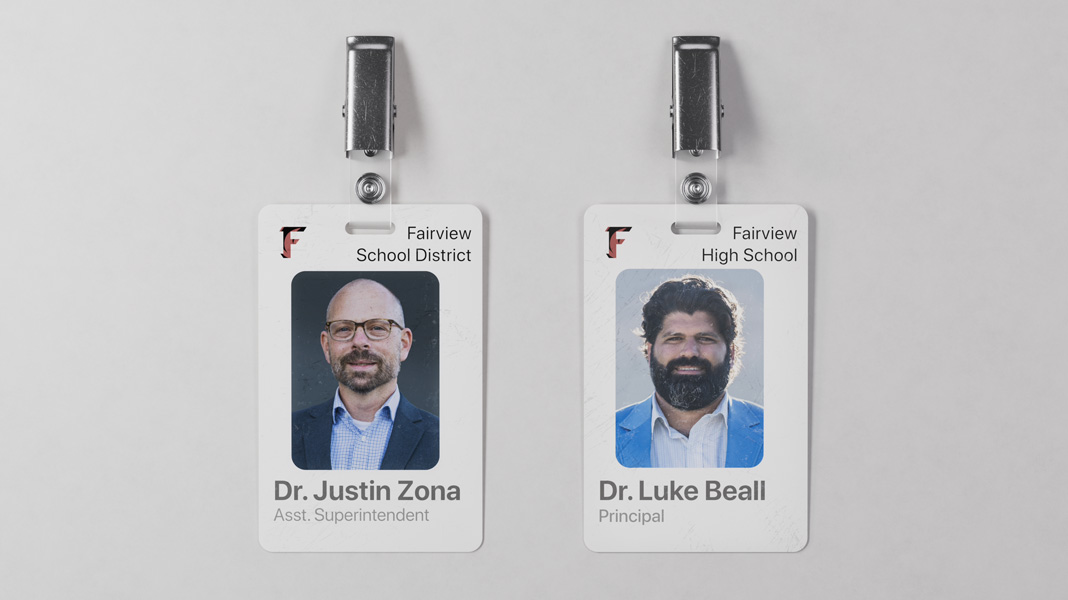 两张 Fairview 学区的教师胸牌并排放置，左边的是 Justin Zona 博士，右边的是 Luke Beall 博士。