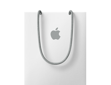 白色 Apple 购物袋，靠近顶端位置印有 Apple 标志。