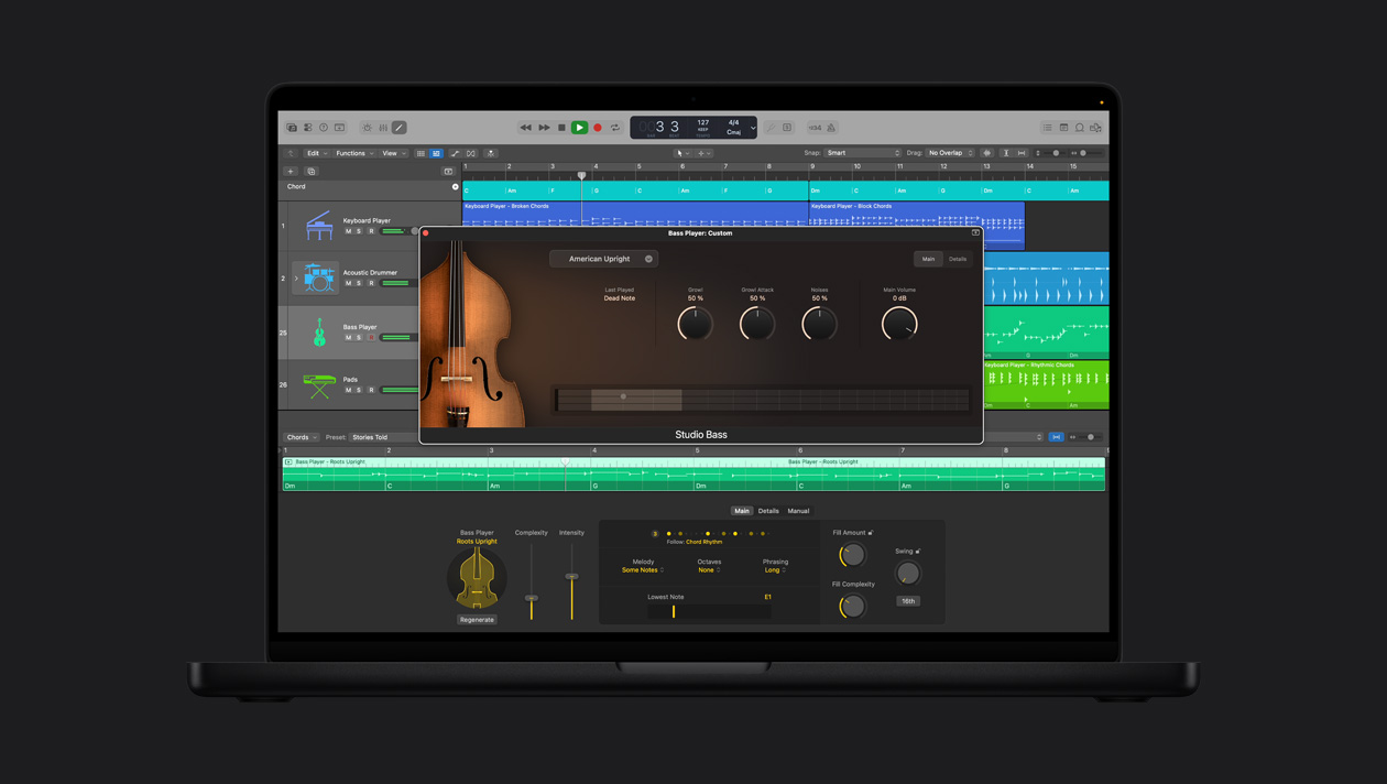 16 英寸 MacBook Pro 屏幕显示低音提琴手，窗口呈打开状态，展示 Studio Bass 控制项；左侧一列为 Keyboard Player、Acoustic Drummer、Bass Player、Pads，底部为 Bass Player Roots Upright 控制项。